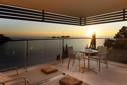 a dining room with a view of the ocean at Hotel More in Dubrovnik
