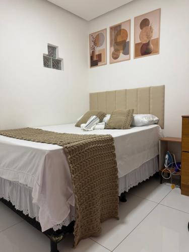 a bedroom with a bed with a blanket on it at Casa siles 2 in Mucugê