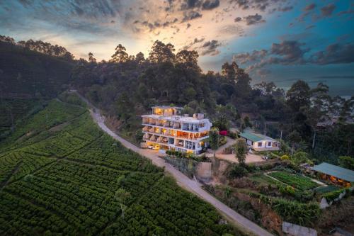 an aerial view of a large house on a hill at leisure Mount View in Haputale