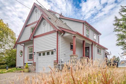 a white house with red trim at Twin Rocks Beach House in Rockaway Beach