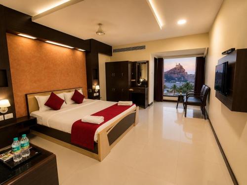 a hotel room with a bed and a television at Hotel Rockfort View by Park Elanza in Tiruchirappalli