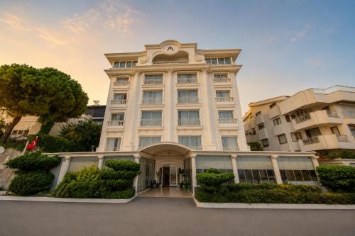 a large white building with an entry way at Massimo Hotel - Adults Only 'Ex La Boutique Hotels' in Antalya