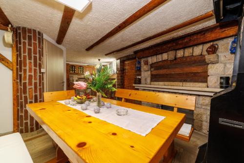 a wooden table in a room with a table sidx sidx sidx at Villa Adry 2 in Bribir