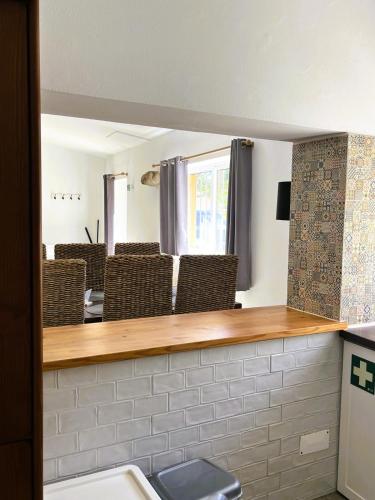 a mirror in a room with chairs and a sink at Off-grid Guest House in the Algarve in Portimão