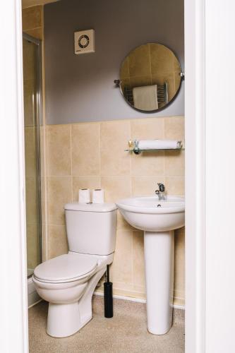 a bathroom with a toilet and a sink at Red Lion Inn and Motel in York