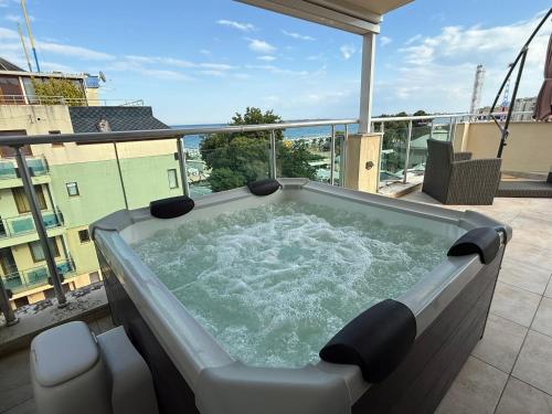 a hot tub on the balcony of a building at YS Residence in Sunny Beach