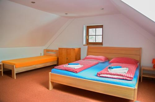 Postel nebo postele na pokoji v ubytování Vila Pod Bránou