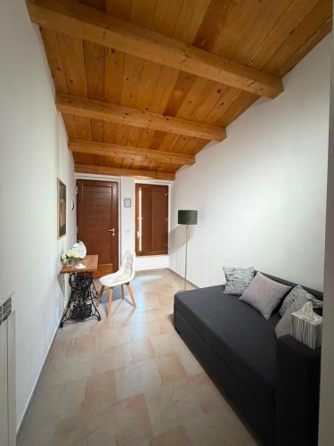a living room with a bed and a table at Ai Sette Scalini in Larino