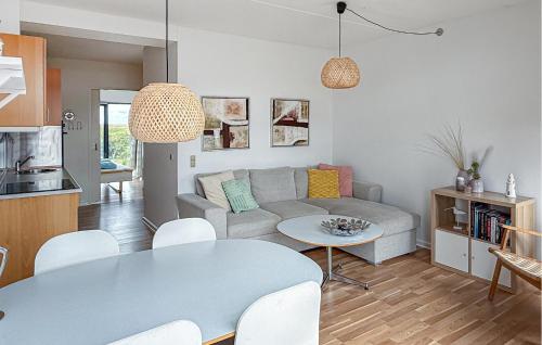 a living room with a couch and a table at Fanø Bad, Lejl 56 in Fanø