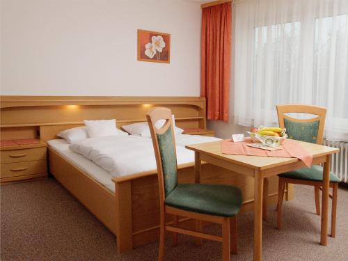 Gästehaus Brunner tesisinde bir odada yatak veya yataklar