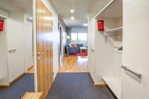 a hallway with a door leading to a living room at Ruka Ski Chalets in Ruka