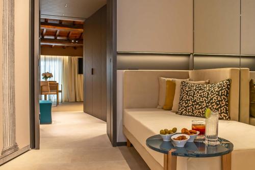 a living room with a couch and a table at Domus Teatro di Pompeo in Rome