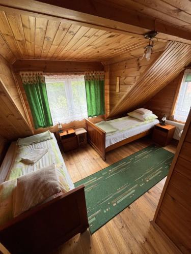 an overhead view of a bedroom with two beds at Domek Pod Skansenem in Białowieża