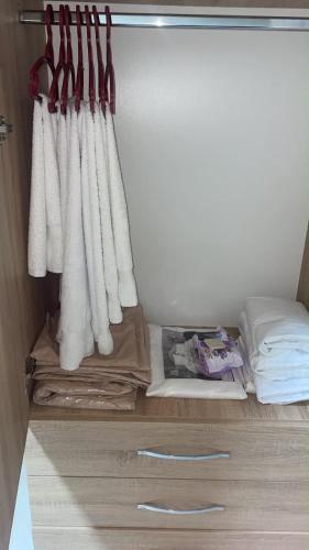 a room with a bed with white curtains at Aldo House in Prekal