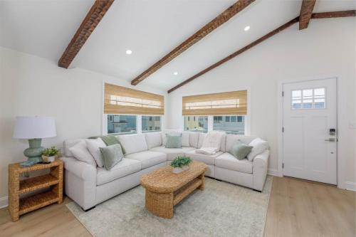 a living room with a couch and a table at Mermaid Lane #2 in Brighton Beach