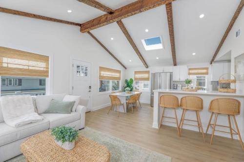a living room with a couch and a kitchen at Mermaid Lane #2 in Brighton Beach