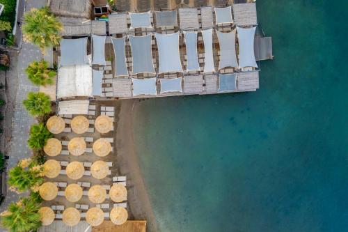 an overhead view of a beach with chairs and water at Costa Farilya Special Class Hotel Bodrum in Gundogan