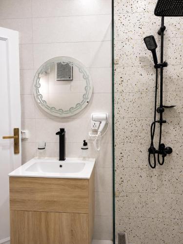 a bathroom with a sink and a mirror at Tahrir Residence -"Marriage Certificate Required for Couples" in Cairo