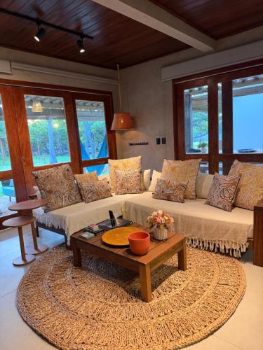 a living room with two couches and a coffee table at casa LuMar in Atins