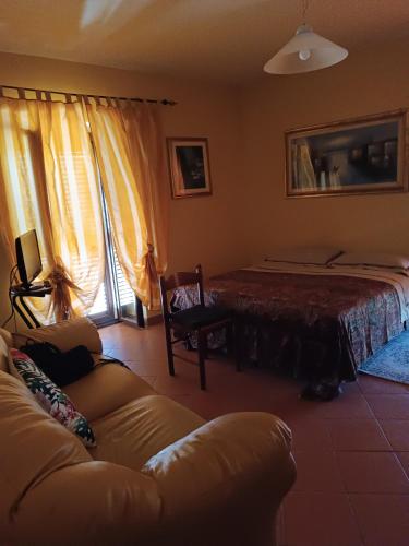 a living room with a couch and a bed at VILLA flora e Riccardo in Fara San Martino