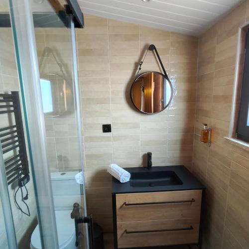 a bathroom with a sink and a mirror at Casa Fornos de Amor in Fornos de Algodres