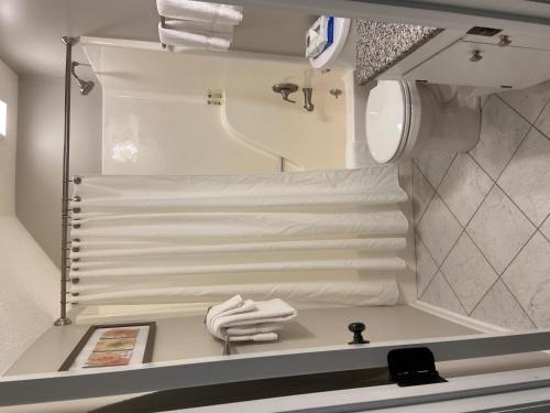 a bathroom with a sink and a mirror and towels at Laurelwood 95 with Wintergreen Advantage in Wintergreen