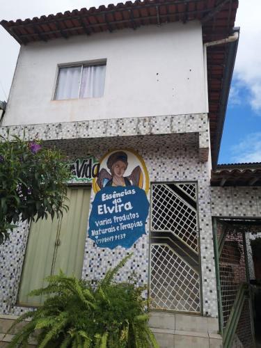 a building with a sign on the side of it at Quarto Alecrim in Ibicoara