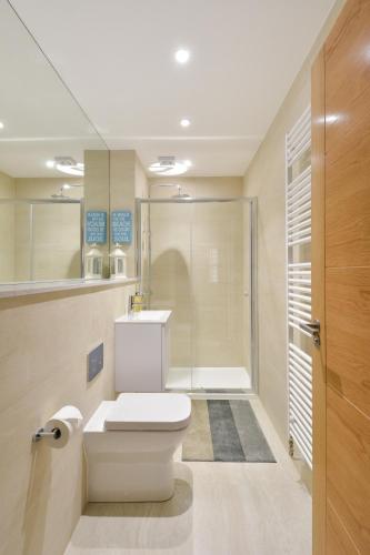 a bathroom with a toilet and a shower at Westview in St. Andrews
