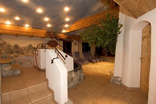 a room with a bath tub in a building at Das Grünholz Aparthotel in Mühlbach am Hochkönig