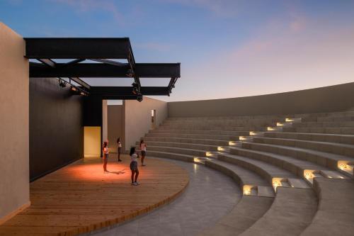 a large amphitheater with people standing in it at JAZ Elite Riviera in Port Ghalib