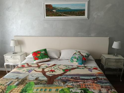 a bedroom with a bed with a tree on it at Prie De Mä in Genoa