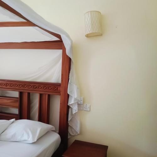 a couple of bunk beds in a room at Summer Studio Suit in Malindi