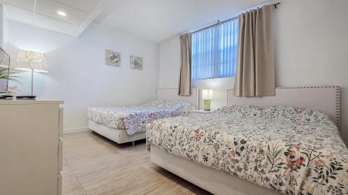 a bedroom with two beds and a window at THE TIDES 1 bedroom apt 8th floor WE ARE ON THE BEACH in Hollywood