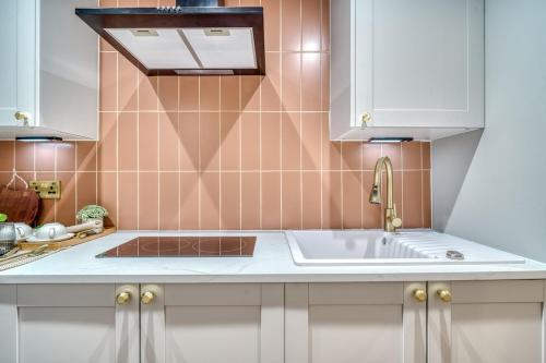 a kitchen with a sink and a counter top at Cozy Studio in Eccles - Salford, Manchester in Manchester