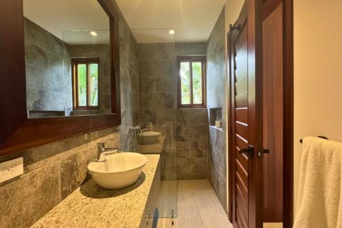 a bathroom with a sink and a mirror at Jama Campay Hotel by Otium in Los Camarones