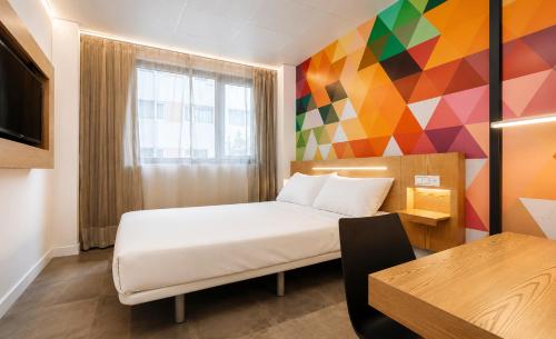 Lova arba lovos apgyvendinimo įstaigoje Vértice Roomspace