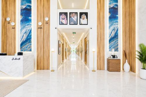 a hallway in a building with pictures on the ceilings at Liora Boutique in Riyadh