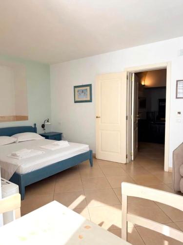 a bedroom with a bed and a room with a door at Residence Del Casalnuovo in Matera