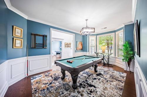 a pool table in a room with blue walls at The Blue Crown Manor at Concord Estates in Concord