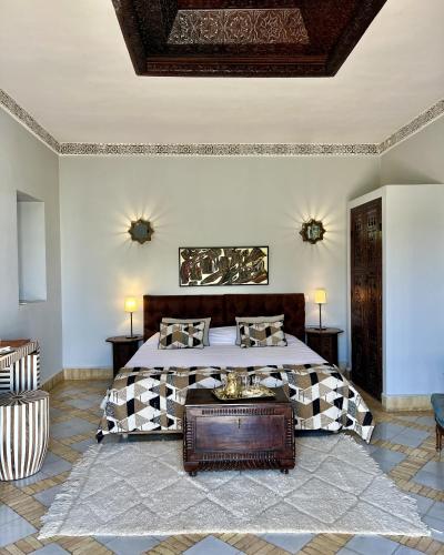 a bedroom with a large bed in a room at Palais El Arsat & Spa in Marrakesh