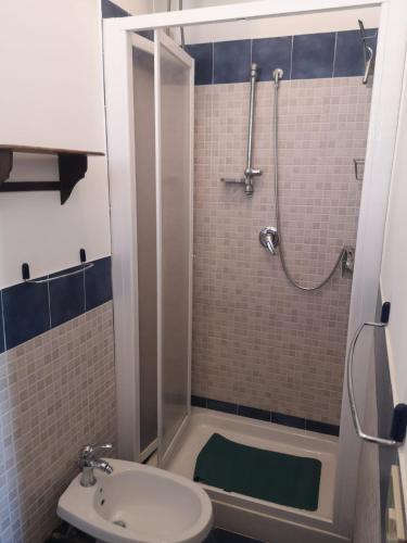 a bathroom with a shower and a sink and a toilet at Terrasini 218 in Terrasini