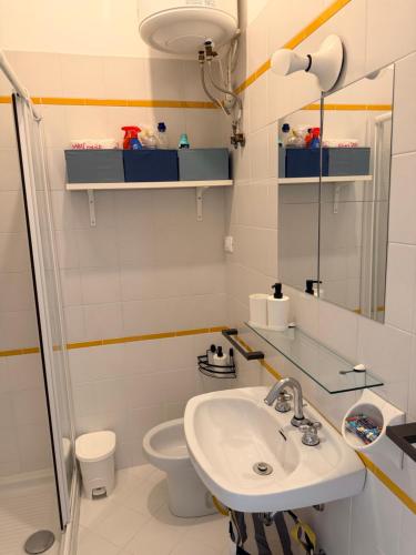 a bathroom with a sink and a toilet at Blu 31 Marcelli in Marcelli