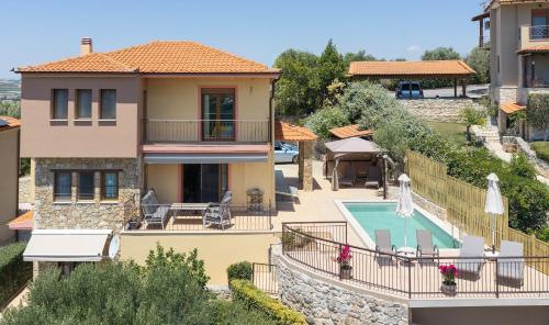 a view of a house with a swimming pool at The Grand Panorama Villa in Nea Moudania