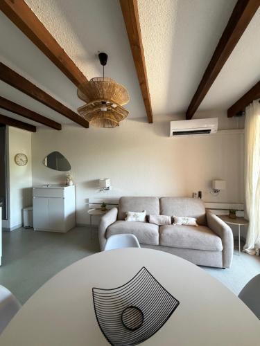 a living room with a couch and a table at Stella-Bianca in Sagone