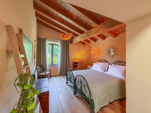 a bedroom with a large bed in a room at Ca' Bella Hospitality in Vignole Borbera