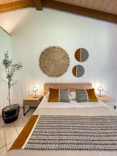 a bedroom with a large bed and two lamps at Su Cappeddu Agriturismo in San Giorgio