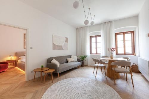 a living room with a couch and a table at Pension Marie in Český Krumlov
