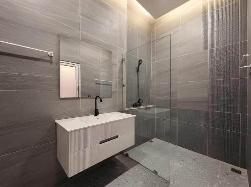 a bathroom with a white sink and a shower at Villa Monroe - Elegant Private Pool Villa in Ban Nok