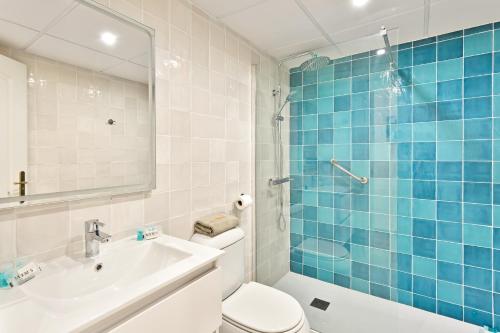 a bathroom with a toilet and a sink and a shower at CasaBella Marina Duquesa in Manilva