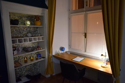 a desk in a room with a window at Studio MAYA in Maribor
